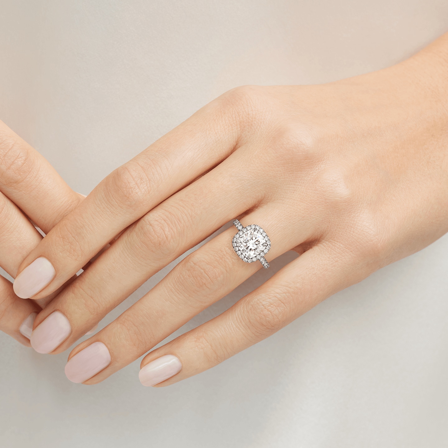 The One Cushion-Cut Diamond Micropavé Engagement Ring featured on a model